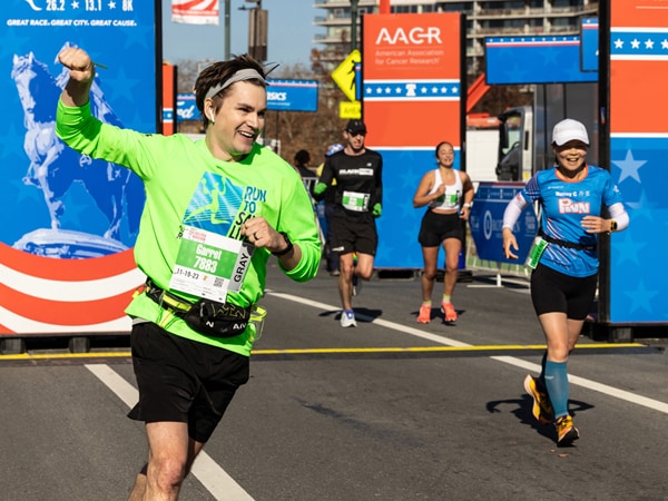 A member of the AACR Runners for Research team at the finish line during AACR Philadelphia Marathon Weekend